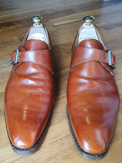 Shiny pair of light tan Crockett & Jones monk shoes